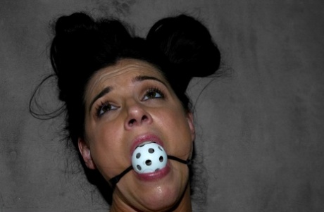 Black-haired mature India Summer gets gagged & toyed in a concrete room