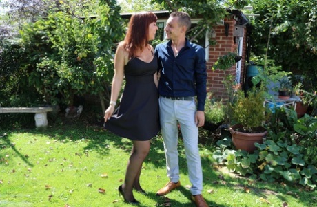 Redhead mature Angelique Luka reveals her big boobs and gets fucked hard