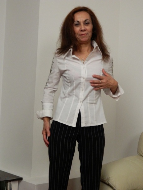 Mature Adelia strips off her clothes and masturbates with a dildo