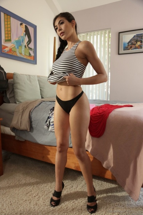 Stunning pornstar takes off he clothes and shows big fake tits and round ass