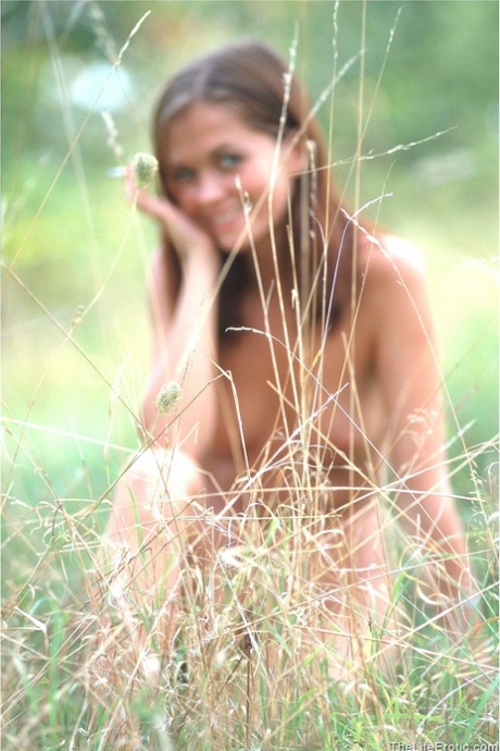 Charming teen Barbara undresses to show her beautiful naked body outdoors
