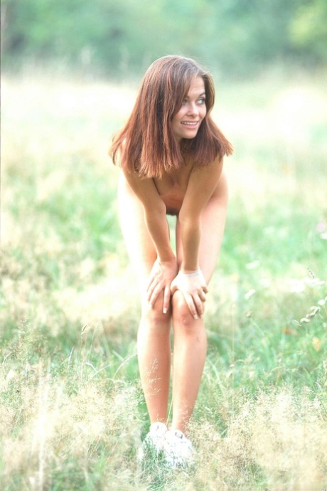 Charming teen Barbara undresses to show her beautiful naked body outdoors