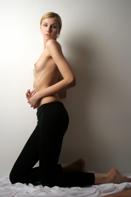 Small titted teen Layla S shows her sweet figure and poses nude