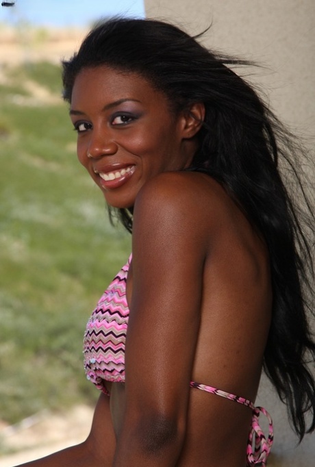 Hot ebony teen Monica Foster strips & shows her sexy curves on the balcony