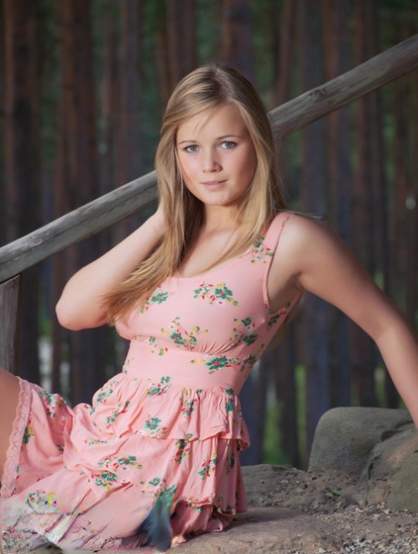 Gorgeous teen babe Sandy C strips outside her cabin & spreads her pussy
