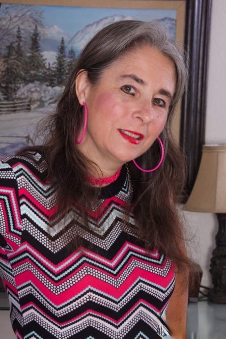 Mature granny Grace removes her clothes and rubs her bush in a solo
