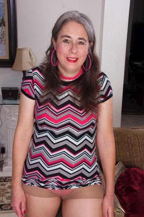 Mature granny Grace removes her clothes and rubs her bush in a solo