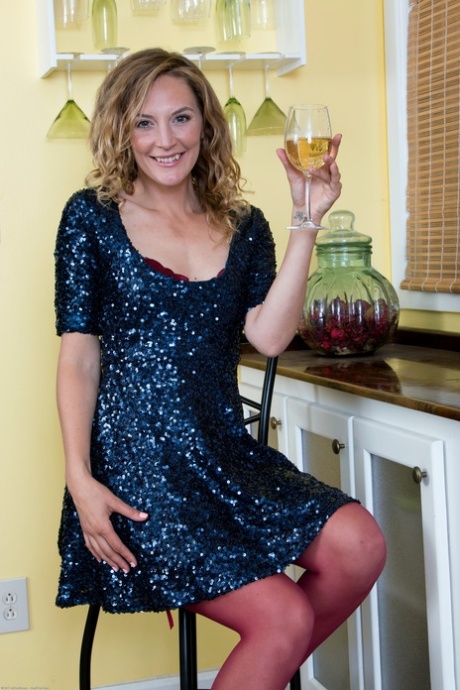 Sexy MILF Mona Wales shows her tiny tits and spreads her legs in red lingerie