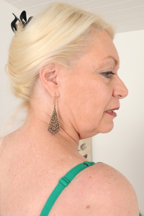 Fat granny with big pierced tits Angelique undresses and plays with her muff