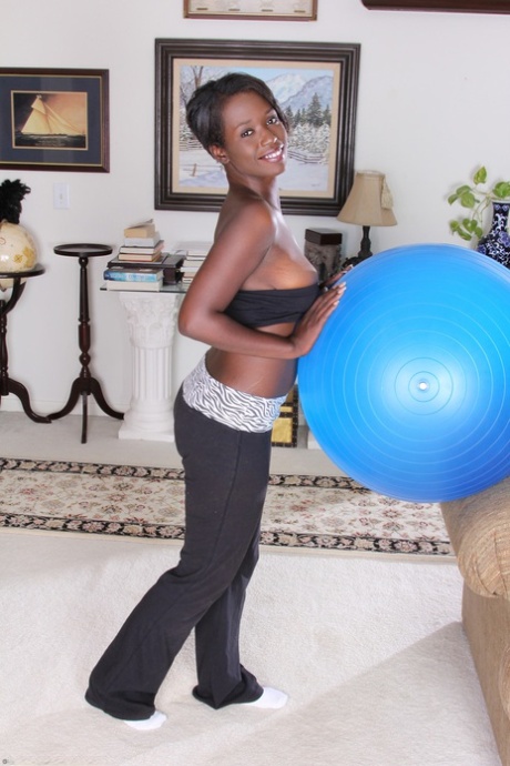 Hot ebony Sayanna Monroe displays her big hanging tits & her tasty black pussy