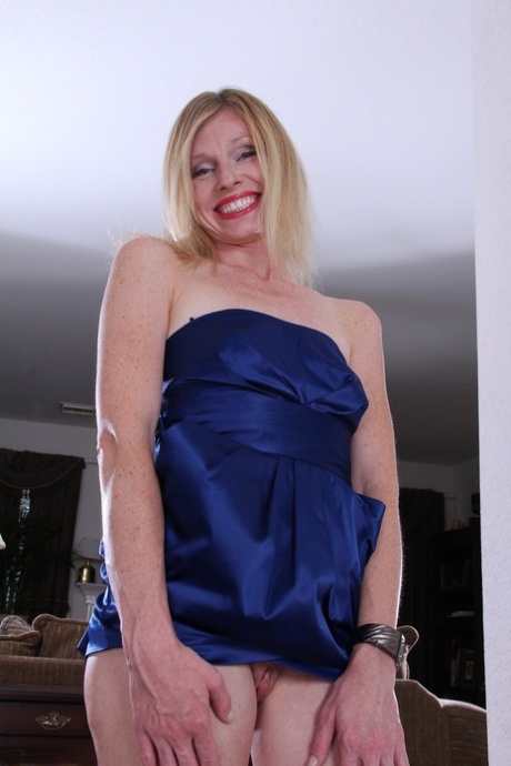 Beautiful blonde MILF Tommi shows her irresistible pussy up close