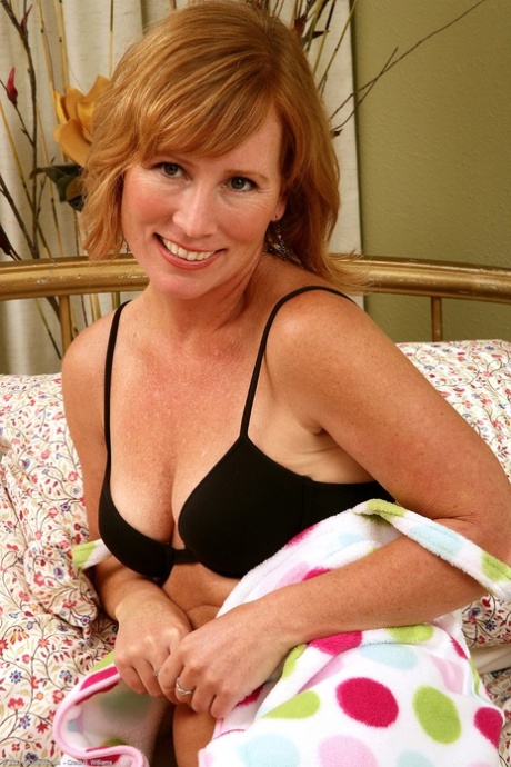 Charming MILF Cheyanne on her back fingering and toying her sexy pussy
