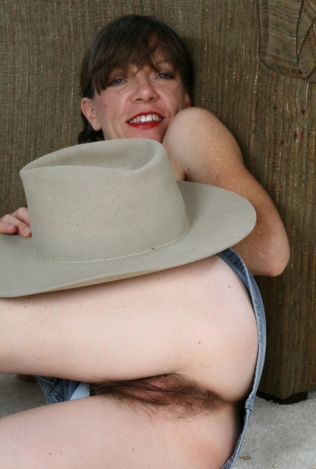 Sexy mature cowgirl Lacy strips off her clothes & shows her hairy body & pussy
