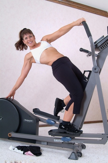 Hot MILF Andie strips naked and shows off her big ass at the gym