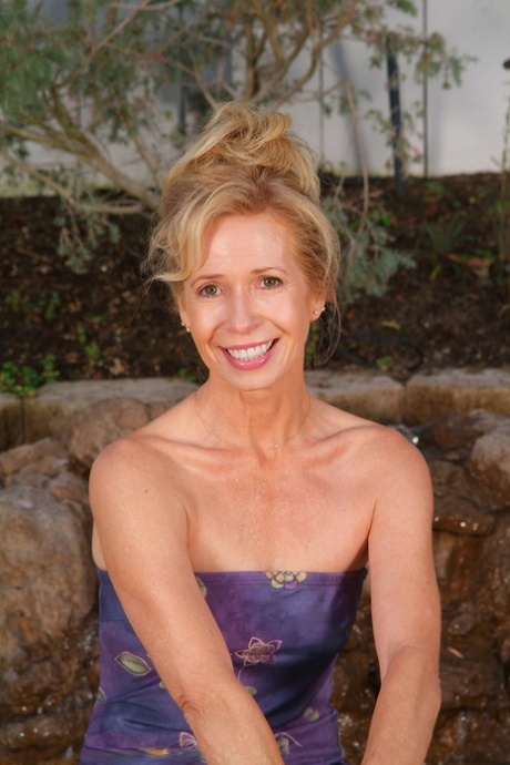 Petite MILF Marie-Kelly shows off her beautiful naked body outdoors