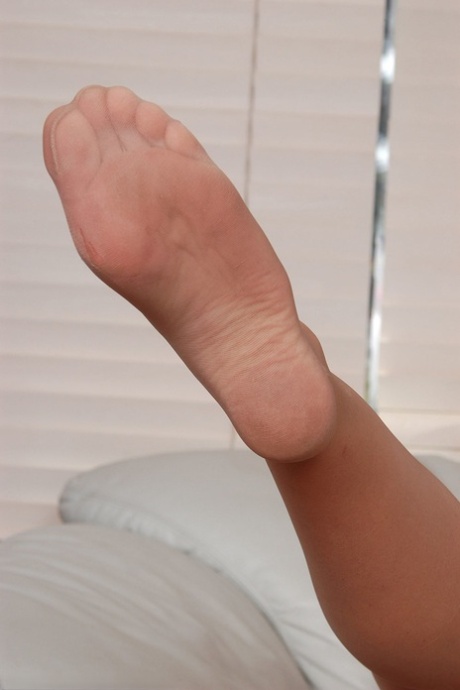 Sexy mature Kathleen removes her dress and flaunts her body in nylons