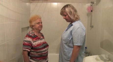 BBW granny Clara lets her lesbian caregiver finger her horny pussy