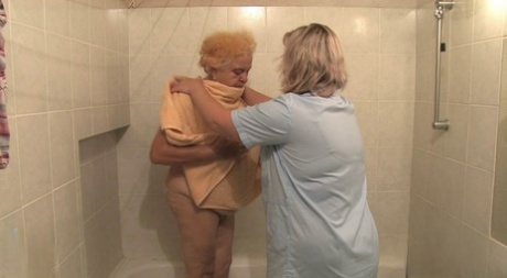BBW granny Clara lets her lesbian caregiver finger her horny pussy