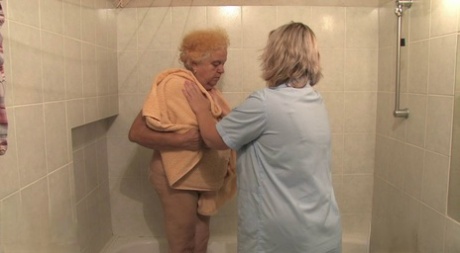 BBW granny Clara lets her lesbian caregiver finger her horny pussy