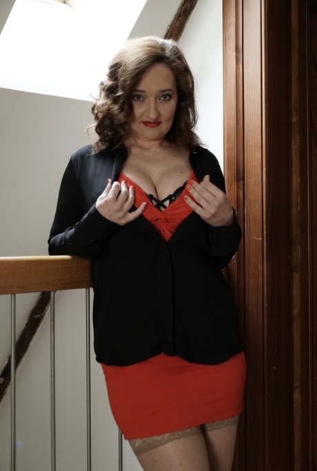 Dirty old mom Ameli lets her big boobs out and toys her cunt on the stairs
