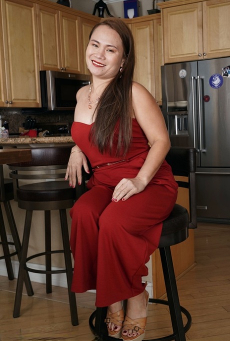 Hot Asian MILF Kim Kreme shows her big booty and massages her yummy pussy