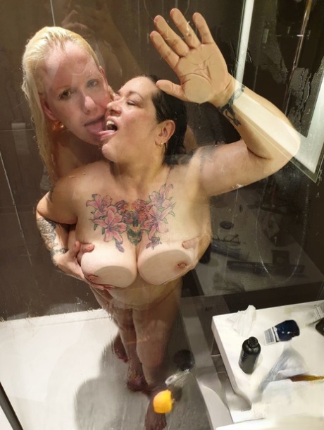 Fatty Kandi Karter gets grabbed by her big tits by a blonde MILF in the shower