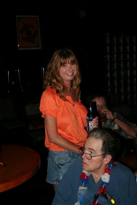 Slutty mature swinger wives expose their big tits & get naughty at a party