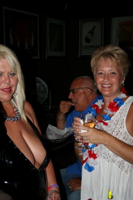 Slutty mature swinger wives expose their big tits & get naughty at a party