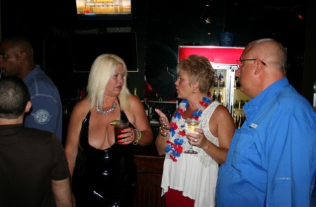 Slutty mature swinger wives expose their big tits & get naughty at a party