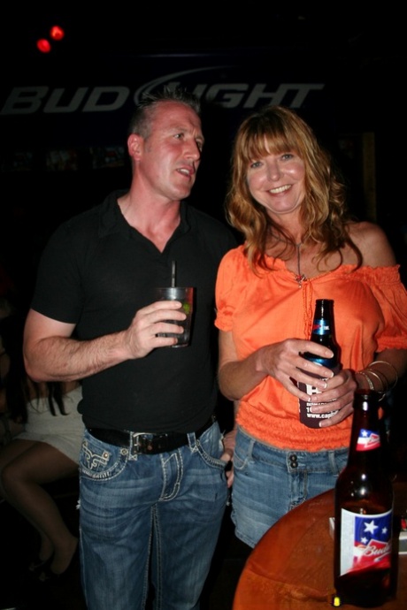 Slutty mature swinger wives expose their big tits & get naughty at a party
