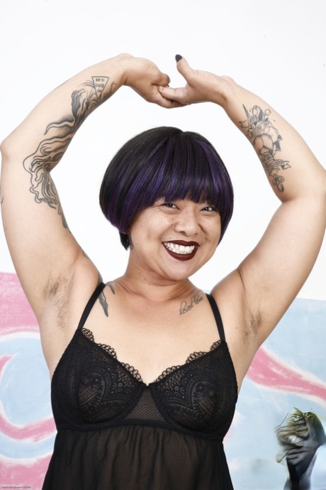 Asian honey Lulu Sparkle flaunts her natural tits, big booty and hairy twat