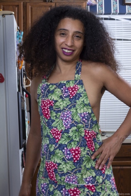 Beautiful curly haired wife Divine shows her small tits & her hairy pussy