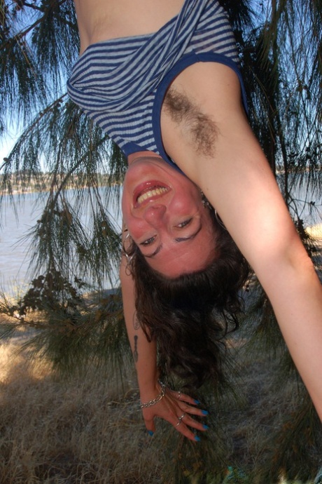 Amateur Sadie Lune undressing and spreading her bush up close under a tree