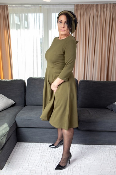 Lovely mature lady Jolie Noir loses her long dress & shows her big booty