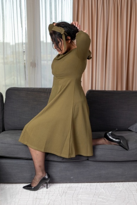 Lovely mature lady Jolie Noir loses her long dress & shows her big booty