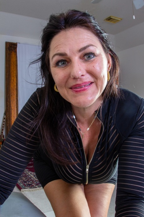 Sweet mature Joana Jakes unveils her big juggs and toys her hairy twat