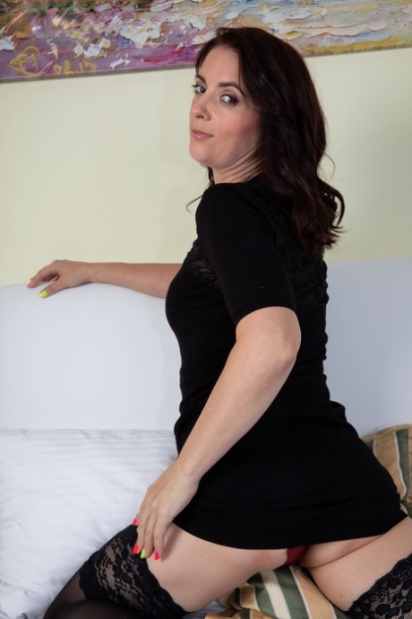 Dark-haired MILF Mary Matte rubs her pussy after peeling her dress & lingerie