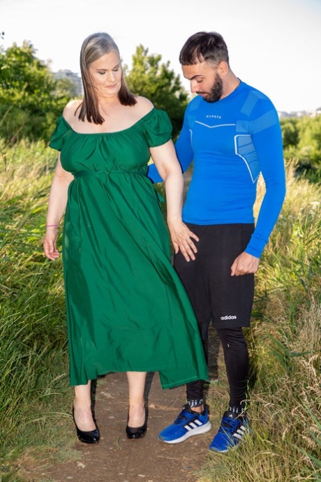 Chubby mature woman with big tits Joy Adams gives a young dude a sex lesson
