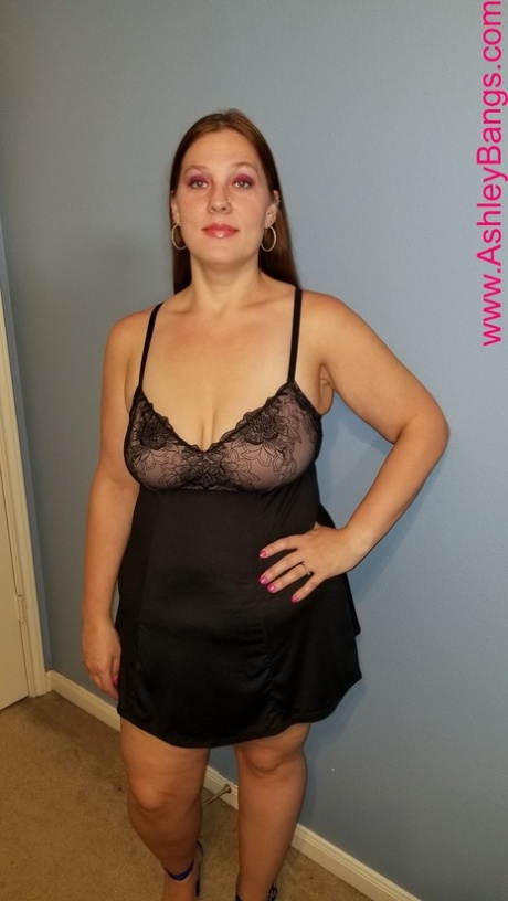Redheaded fatty Ashley Bangs posing in her hot lingerie and high heels
