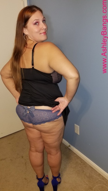 Redheaded fatty Ashley Bangs posing in her hot lingerie and high heels