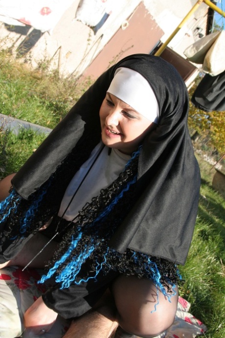 Horny nun in stockings Janine kneels to give a blowjob before outdoor sex