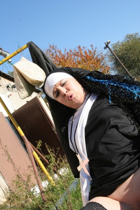 Horny nun in stockings Janine kneels to give a blowjob before outdoor sex