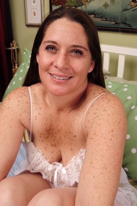 Mature fatty Mary J strips, puts her sexy lingerie on and plays with her pussy