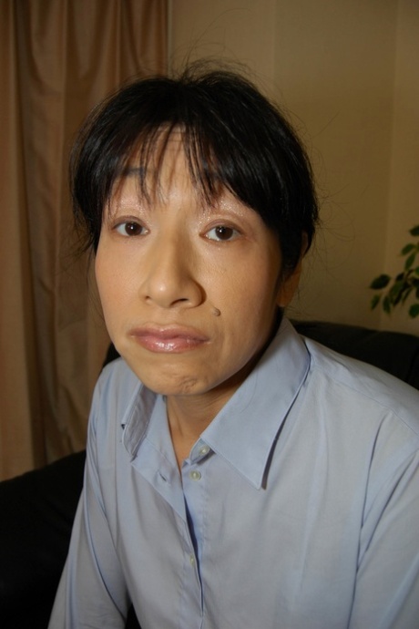 Hairy Japanese granny Chie Kaneko strips and rubs her juicy cunt