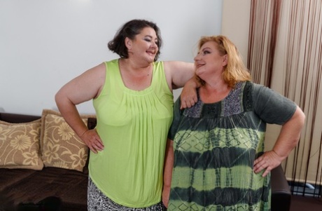 Chubby grannies Edina & Jana envelope a young maid's head with their big tits