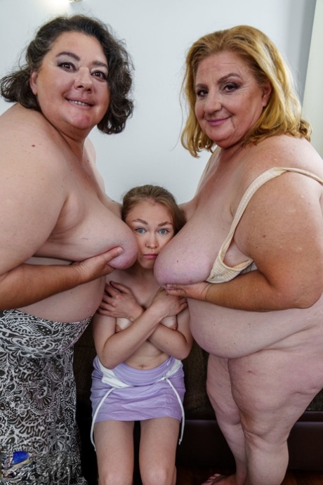 Chubby grannies Edina & Jana envelope a young maid's head with their big tits