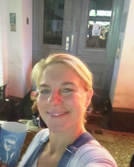 Blue-eyed mature blonde flaunts her hot curvy body while posing in the window