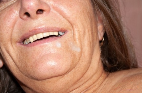 Hairy granny gets spit roasted in an MFM threesome & takes a facial