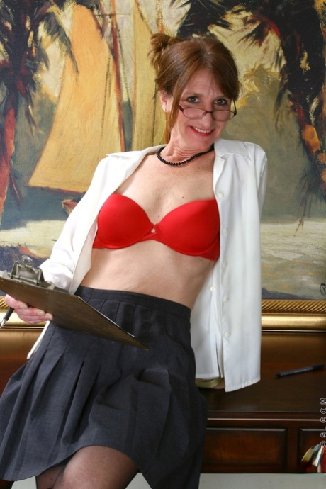Mature secretary in glasses Kimberly bares her tiny tits & spreads her pussy