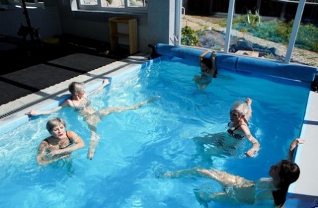 Mature women Valentina Sierra & Belinda Bee fuck young men in a poolside orgy